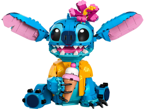 The LEGO® Disney™ Stitch by Legos - Toyhouse features a blue and pink Stitch with a yellow shirt, flower crown, and pink ice cream cone—a cute buildable set that's the perfect Disney gift.