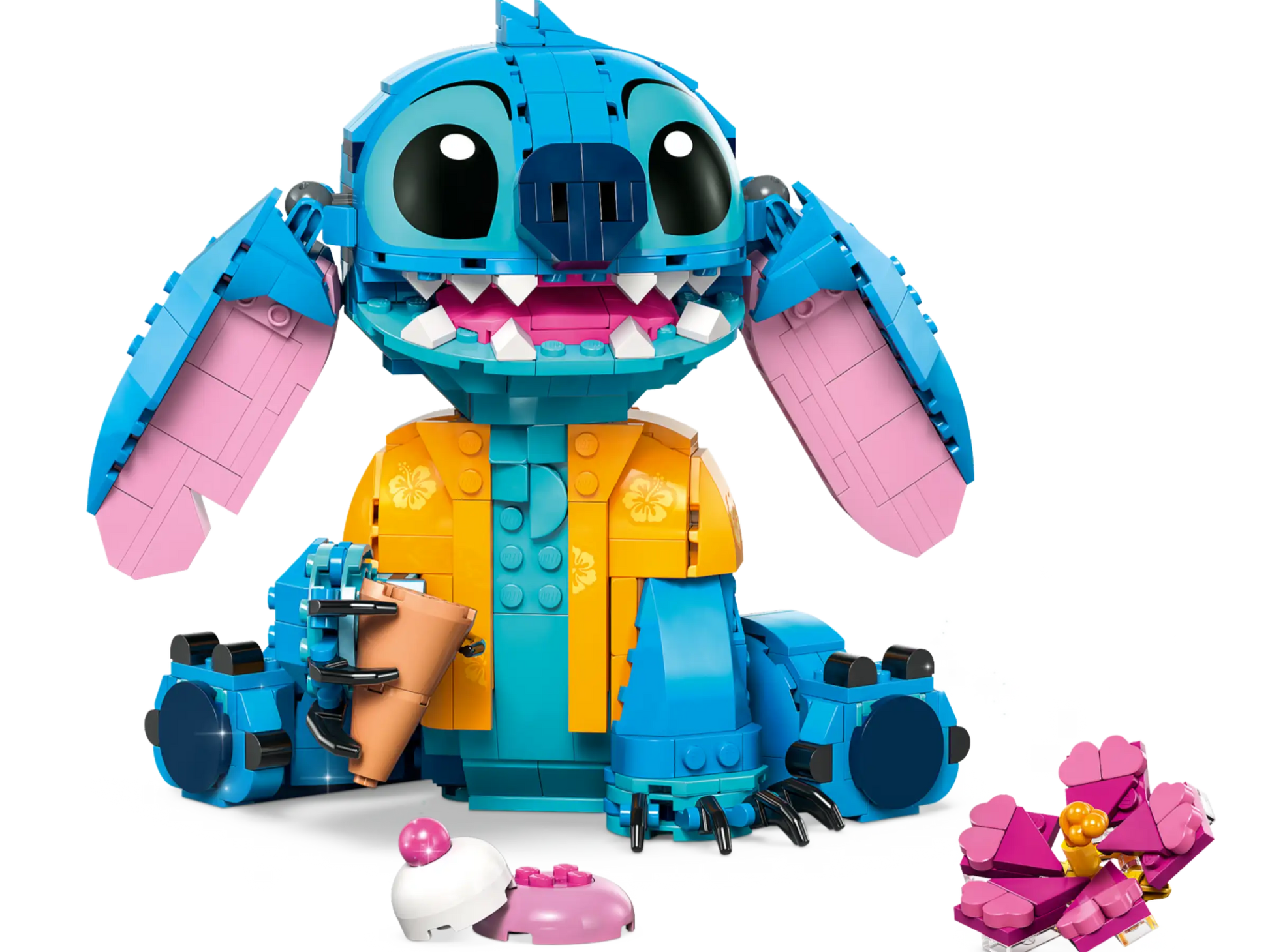 LEGO® Disney™ Stitch by Legos - Toyhouse: a fun buildable set featuring Stitch in a yellow shirt, sitting with a cup, plus pink flower and ice cream—an ideal Disney fan gift.