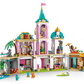 The LEGO® Disney™ Princess Castle & Royal Pets by Legos - Toyhouse features a colorful castle with multiple rooms, towers, a palm tree, plus mini-figures and animal figures arranged around the structure.