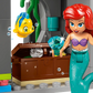 A red-haired LEGO® mermaid with a purple top, treasure chest, and yellow fish adds magic to any Legos - Toyhouse Disney™ Princess Castle & Royal Pets playset with its underwater-themed bricks.