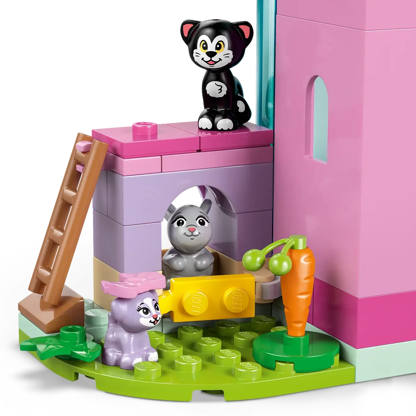 Three toy cats surround a pink and purple building set, LEGO® Disney™ Minnie's Pet Hotel by Legos - Toyhouse, featuring a ladder, carrot, and green grassy base pieces.