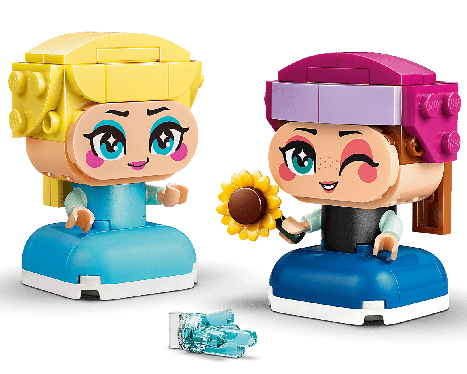 The LEGO® Disney™ Mini Anna & Elsa set by Legos - Toyhouse features two colorful figures with large heads and dresses; one holds a sunflower, while the other has light blue accessories on the ground nearby.