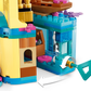 Close-up of the LEGO® Disney™ Ariel's Magical Mini Palace by Legos - Toyhouse, showing a turquoise key in a side mechanism with a white arrow indicating how to turn it.