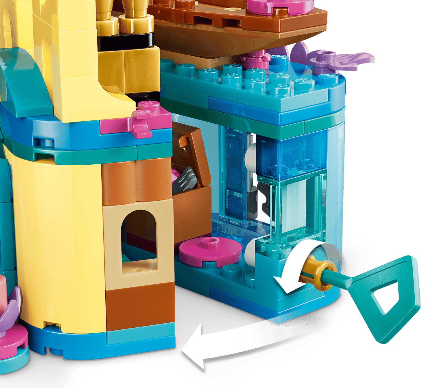 Close-up of the LEGO® Disney™ Ariel's Magical Mini Palace by Legos - Toyhouse, showing a turquoise key in a side mechanism with a white arrow indicating how to turn it.