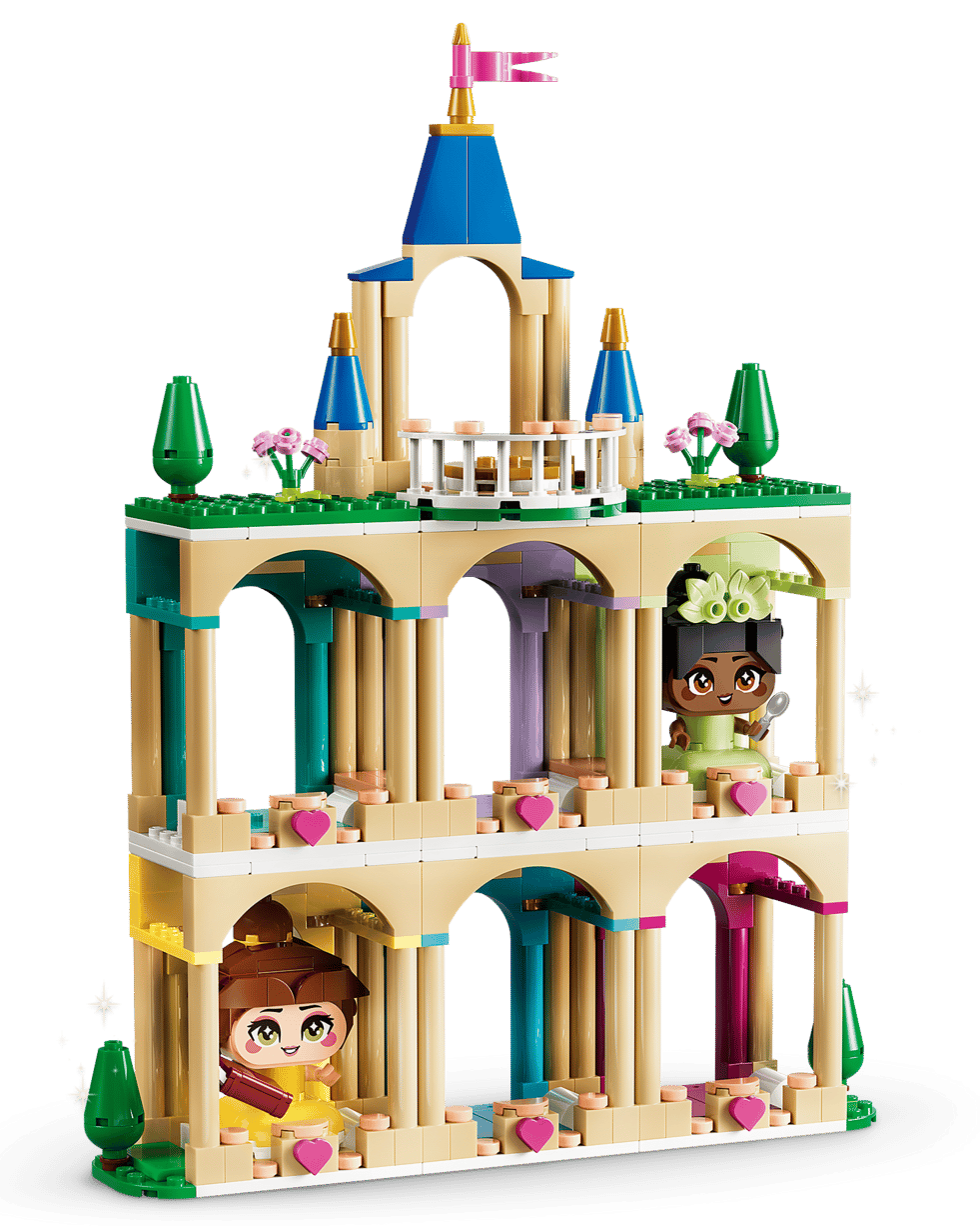 The LEGO® Disney™ Mini Belle & Tiana with Castle by Legos - Toyhouse is a colorful building toy featuring arches, towers, two figurines, and decorative hearts and plants.