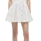 The Sylvia Mini Dress by Simkhai is sleeveless with a white textured fabric and a flared skirt, ideal for sunny days. Pair it with white strappy sandals for an effortless Summer Jacquard look.