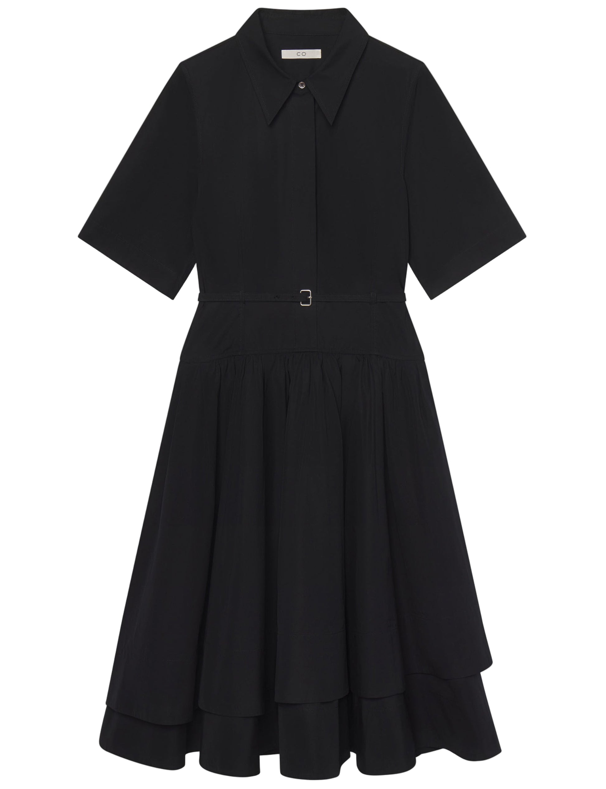 The CO Short Sleeve Belted Dress is a black cotton poplin shirt dress with a collared neckline, button front, belted waist, and tiered chic midi skirt.