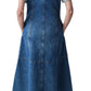 A person in a CO Denim Midi Dress with short sleeves and vertical center back seams, paired with black sandals, facing away.