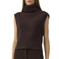 A woman wears the Simkhai Maple Top, a sleeveless brown ribbed turtleneck sweater with a cropped silhouette, paired with brown pants.