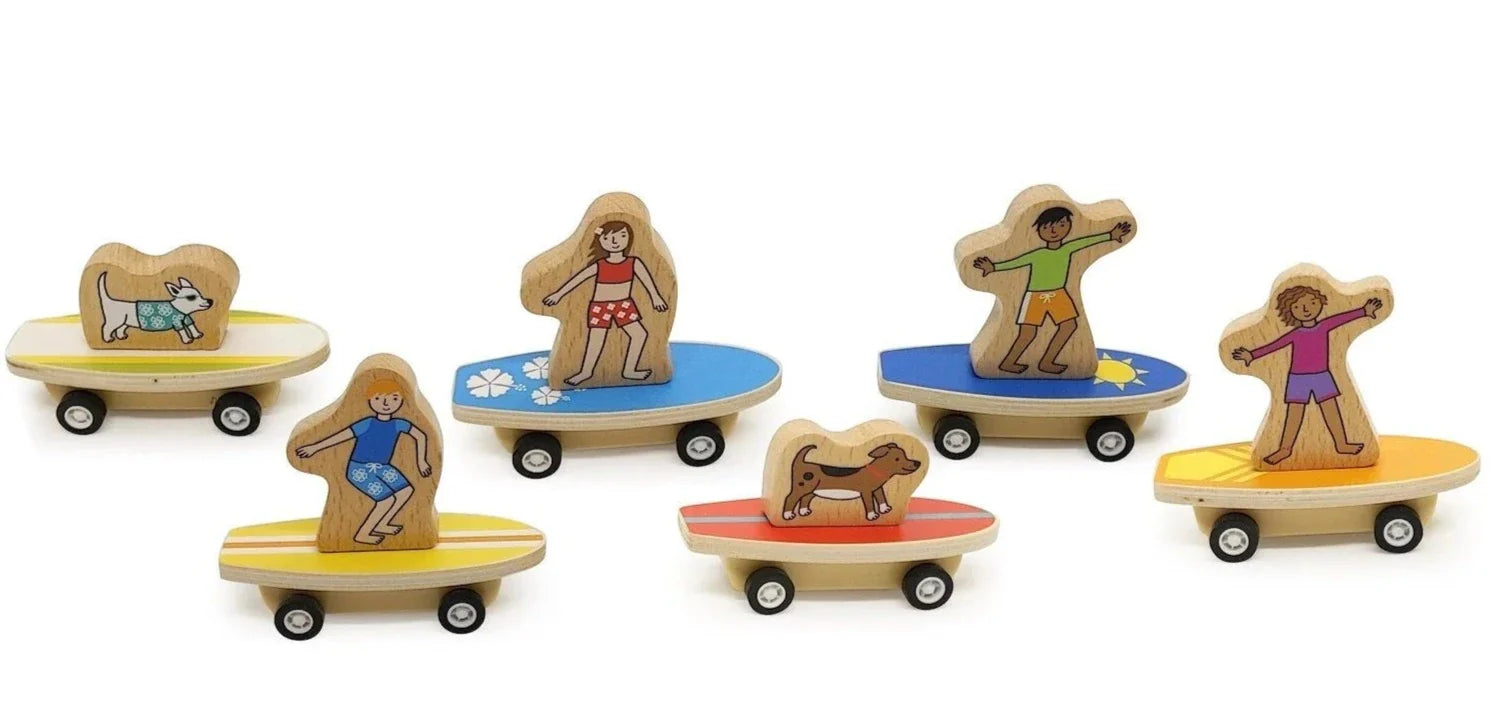 A collection of eco-friendly Jack Rabbit Creations bamboo figurines on wheels, each featuring a character involved in different summer activities such as skateboarding, surfing, and playing with a dog.