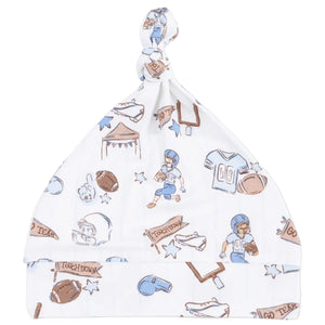 The Angel Dear Knotted Hat is crafted from white bamboo and features a charming top knot. It’s adorned with blue and brown football-themed illustrations—including jerseys, helmets, footballs, players, whistles, and banners—making it the perfect accessory for your little sports fan.