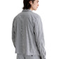 A person with medium-length dark hair is wearing an AG Jeans Philip Zip Jacket, standing and facing away at an angle against a white background.