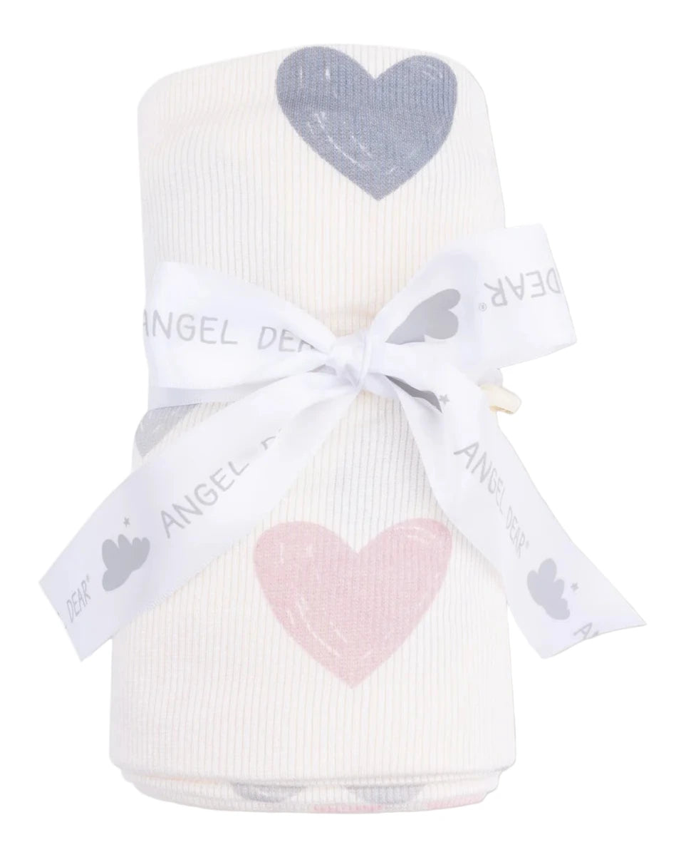 The Angel Dear Swaddle Blanket features a white, ribbed modal fabric with pink and gray heart prints, rolled up and tied with a ribbon. Soft and cozy, it's perfect for newborns.