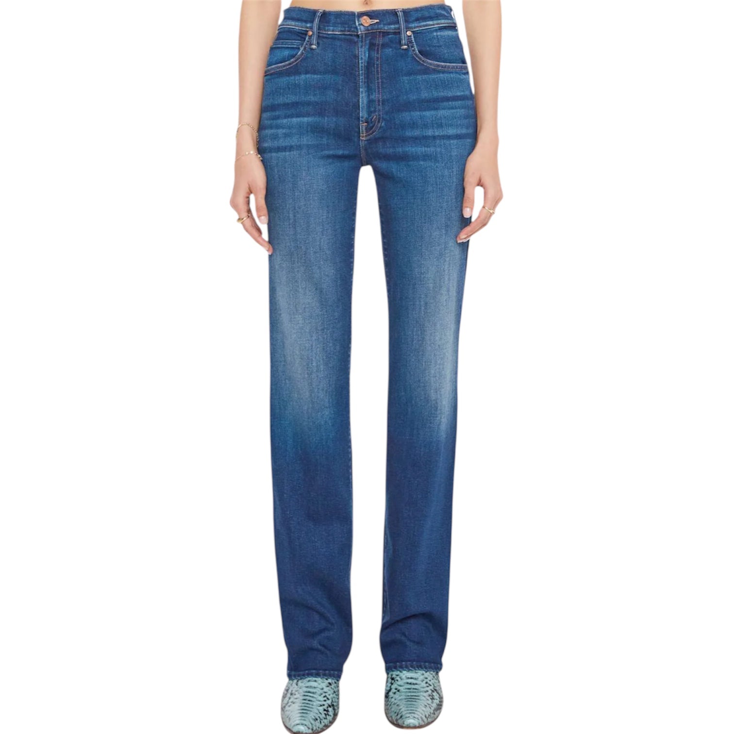 A person wearing Mother’s Kick It high-rise straight-leg jeans in mid-blue recycled stretch denim stands with arms by their sides, turquoise shoes peeking out.
