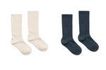 Two pairs of Rylee & Cru Ribbed Socks, one white and one dark blue, are shown side by side on a white background.