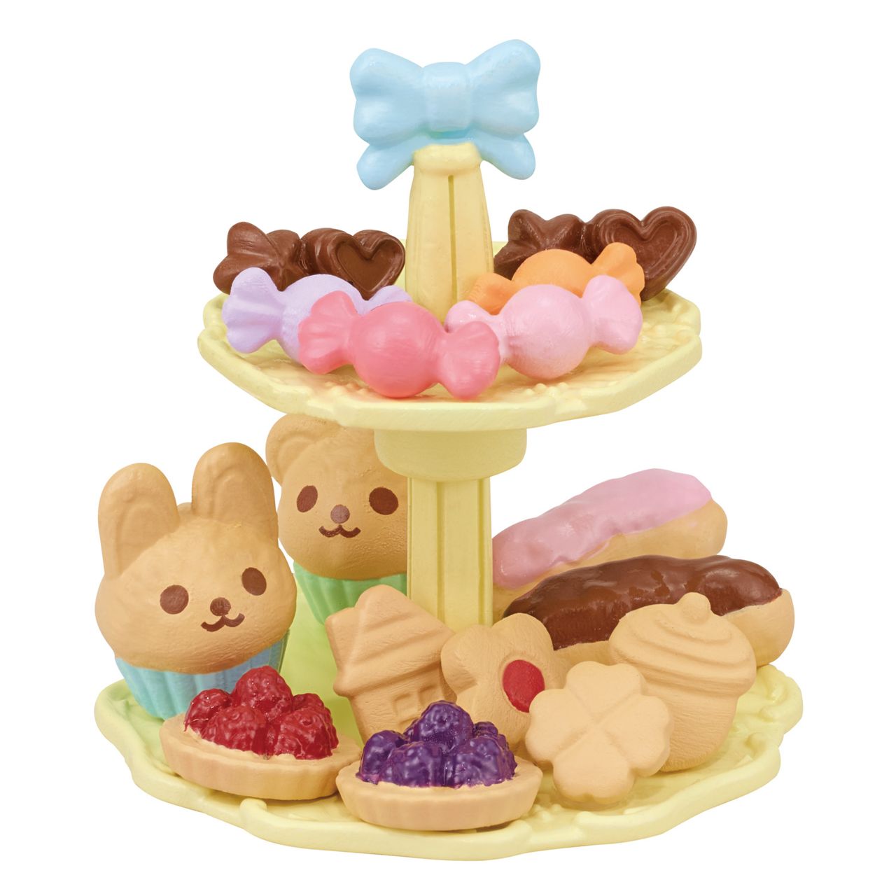 The Calico Critters Sweets Party Set features a two-tiered yellow tray filled with assorted toy desserts—animal-shaped pastries, tarts, candies, and cupcakes adorned with a blue bow—making it perfect for imaginative playtime or pairing with your favorite tea accessories.