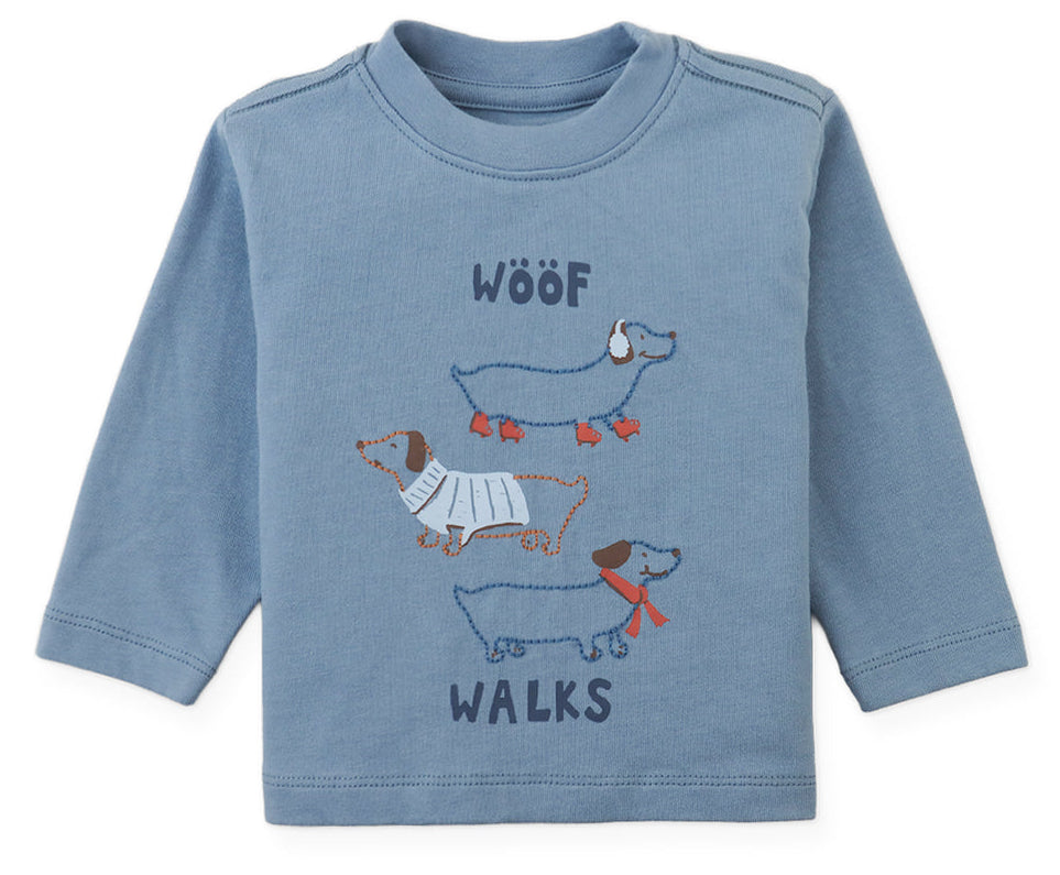 Gingersnaps Baby Boys’ Myron Graphic Tee is a blue long-sleeve shirt featuring a playful “WOOF WALKS” design with three illustrated dachshunds stacked vertically on the front.