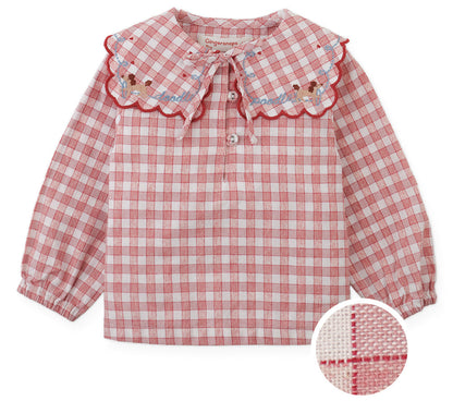 Gingersnaps Baby Girls’ Gracia Checkered Blouse features long sleeves and a red-and-white check pattern. The scalloped sailor collar is embellished with embroidered flowers. Inset highlights a detailed view of the storybook checks pattern and fabric texture.