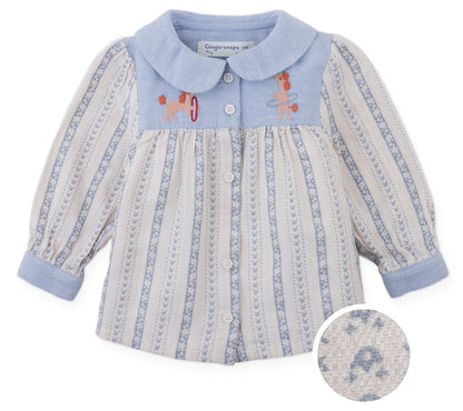 The Gingersnaps Baby Girls’ Hester Striped Floral Blouse features blue and white vertical stripes, a blue collar and cuffs, front button closure, and embroidered dogs playing with hoops on the chest. An inset highlights the textured fabric.