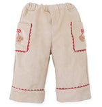 Gingersnaps Baby Girls’ Nellie Pant with Poodle Pocket features a comfy straight-leg design in beige, an elastic waistband, two front pockets with poodle face details and red trim, and cheerful red edging at the cuffs and pocket openings.