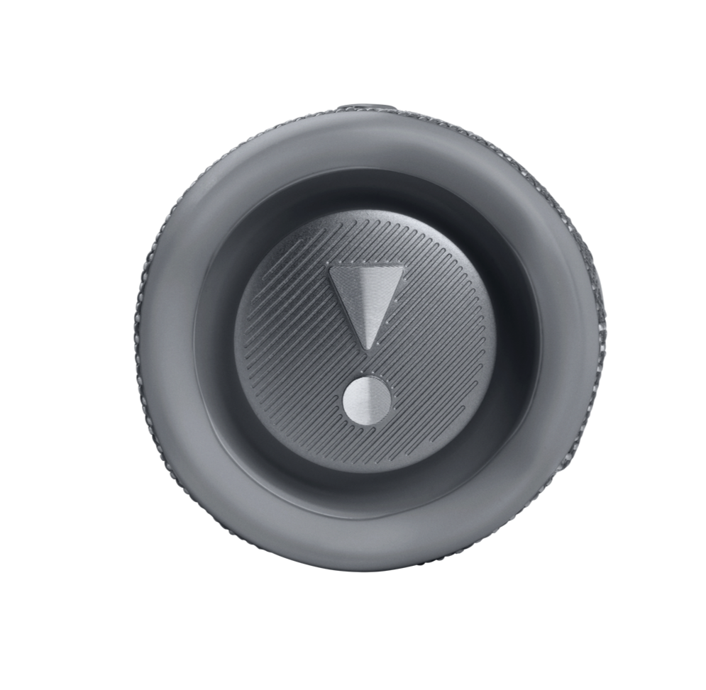 Close-up of a silver button with an exclamation mark symbol in the center, surrounded by a circular border, reminiscent of the robust sound and durable design you'd expect from a JBL Flip 6 Waterproof Bluetooth Speaker.