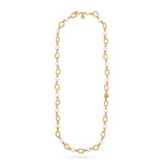 The Berry & Bead Chain by Juliska Capucine De Wulf features textured gold oval links and spaced white beads, ideal for layering. This elegant necklace is shown on a plain white background, evoking a timeless style.