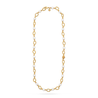 The Berry & Bead Chain by Juliska Capucine De Wulf features textured gold oval links and spaced white beads, ideal for layering. This elegant necklace is shown on a plain white background, evoking a timeless style.