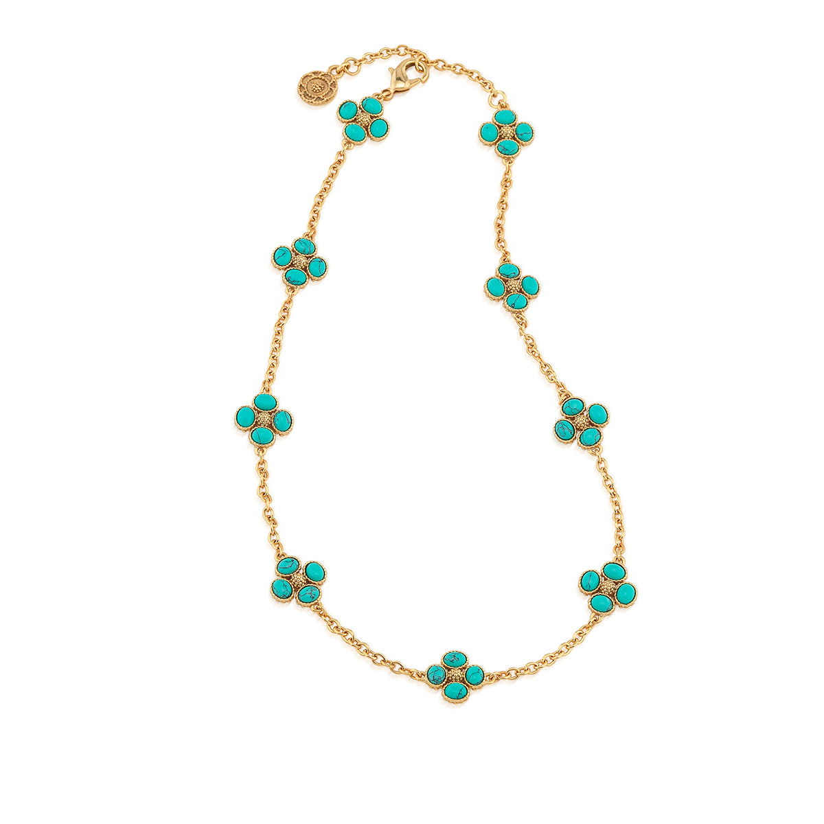 The Juliska Capucine De Wulf Berry Clover Double Sided Necklace showcases eight double-sided berry clovers in turquoise floral clusters, evenly spaced along its gold station chain.