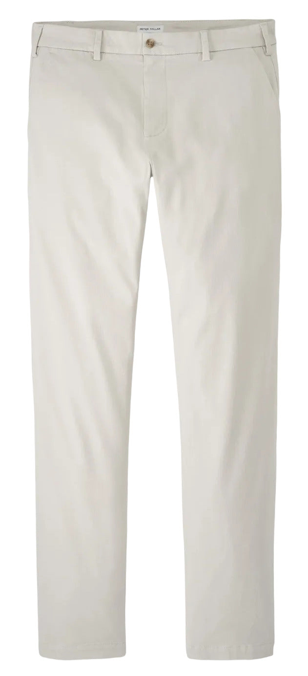 The Peter Millar Signature Sateen Flat Front Trouser is a light beige, straight-leg style made from cotton-stretch fabric with belt loops, side pockets, and button closure.