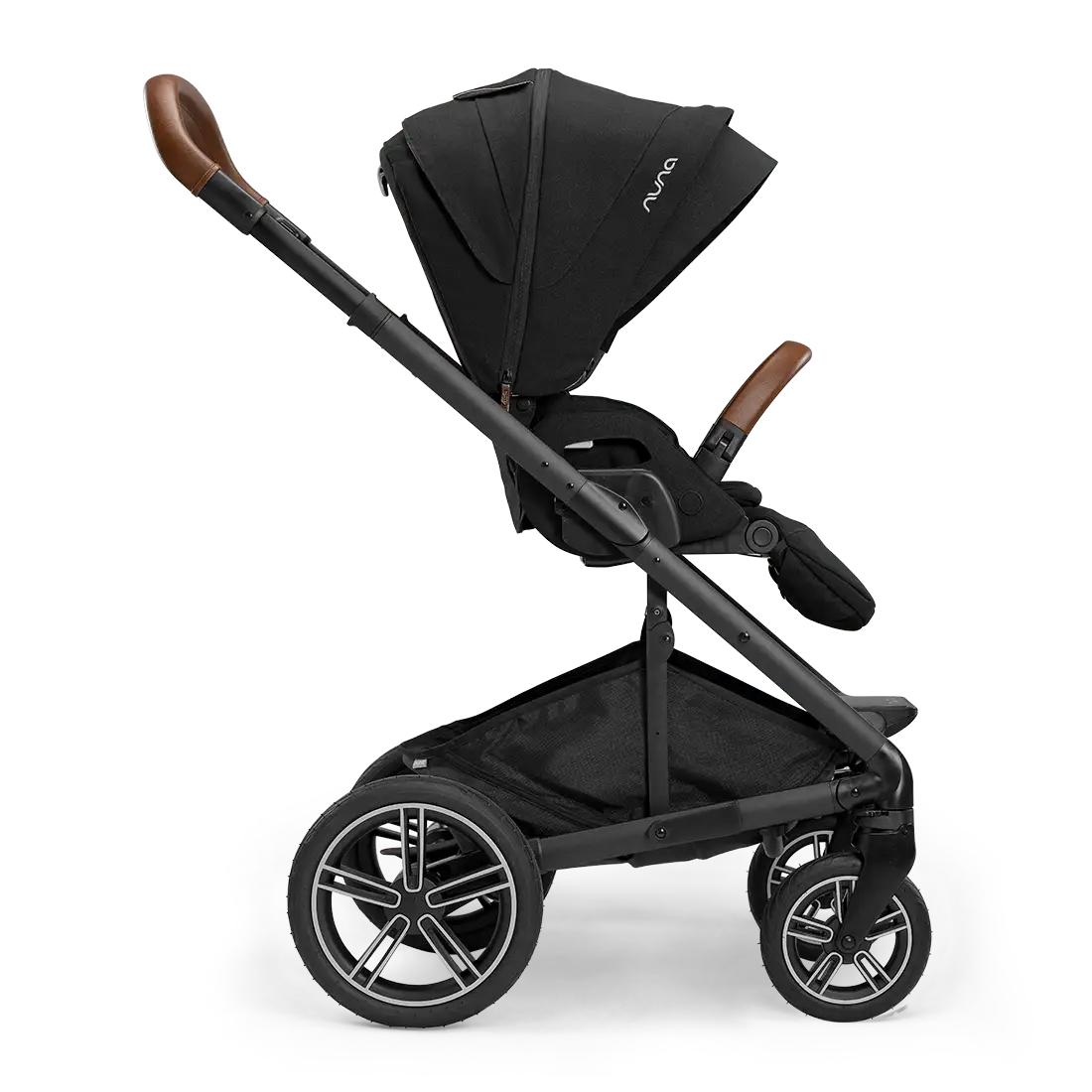 A side view of the Nuna MIXX Next Stroller showcases its sleek black design with brown handle grips and a retractable canopy featuring the innovative MagneTech Secure Snap™. For added convenience, this stroller from Nuna folds compactly, making it ideal for families on the go.