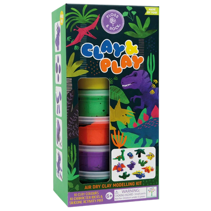 Floss and Rock’s Clay & Play - Dinosaur is a boxed air dry clay kit with 10 colors, character ideas, a silicone activity mat, and playful dinosaur-themed packaging with colorful illustrations.