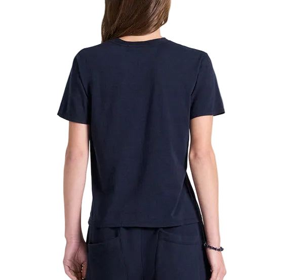 Person wearing TWP His Tee and matching pants, shown from the back against a white background—an essential for any women’s wardrobe.