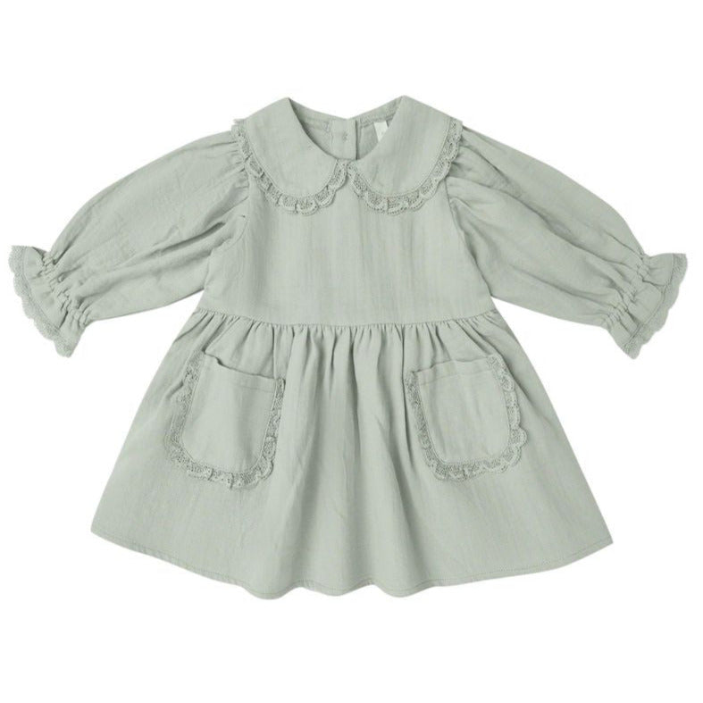 The Quincy Mae Baby Girls’ and Girls’ Marisol Dress in light green features a Peter Pan collar, lace ruffle trim, ruffled cuffs, and two front pockets.
