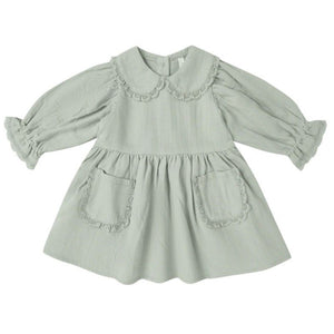 The Quincy Mae Baby Girls’ and Girls’ Marisol Dress in light green features a Peter Pan collar, lace ruffle trim, ruffled cuffs, and two front pockets.