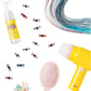 The Hairstyle Hero Salon Kit by Super Smalls includes striking hair extensions, colorful accessories, a spray bottle, yellow hair dryer, and pink detangling brush on a white background.