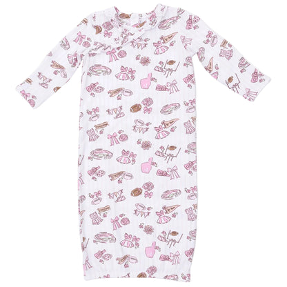 Dress your little one in the Angel Dear Baby Girls’ Kimono Gown, a long-sleeved white gown crafted from ultra-soft bamboo viscose and featuring whimsical pink and brown illustrations of ballet shoes, crowns, flowers, and other playful accessories. Complete the charming outfit with the matching ruffle knotted hat for an irresistibly cute look.