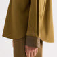TWP A Case of You Shirt in olive green cotton, featuring a long-sleeved kangaroo silhouette with a contrasting dark brown leather collar and cuffs.
