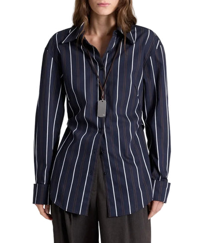 TWP The Night We Met Stripe Shirt in striped cotton with dark blue and white vertical stripes, worn with a silver rectangular pendant on a leather cord.
