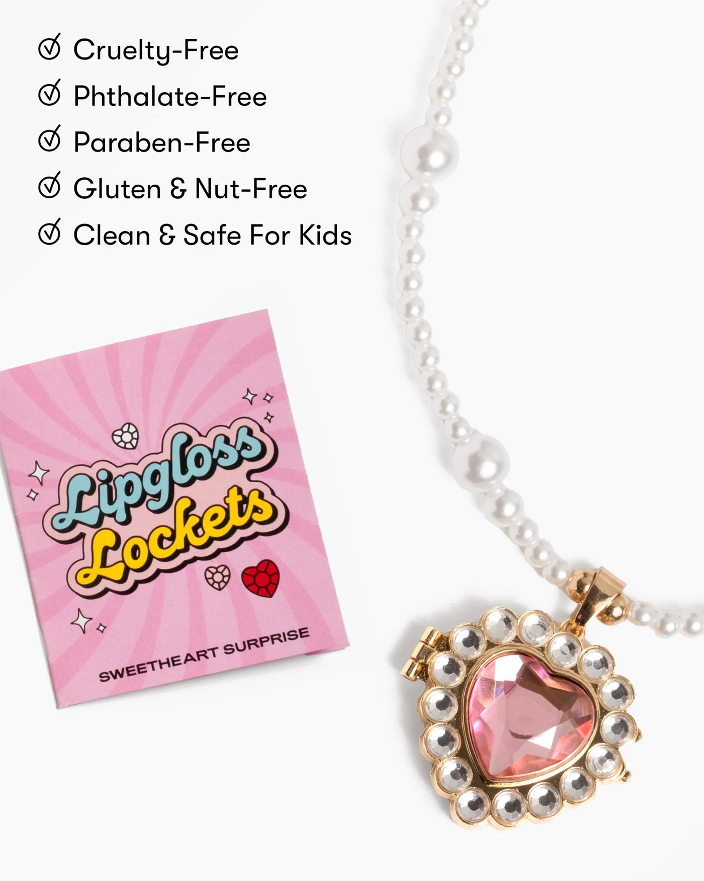 A heart-shaped faux-pearl necklace from Super Smalls, the "Sweetheart Surprise Lipgloss Locket," features a lip gloss container, shown beside its packaging and a list of safety/allergen-free highlights.
