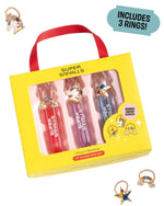 Super Smalls Gloss it Rainbow Lip Gloss Ring Set featuring three fruity lip gloss tubes and three sparkly rings, shown both in and out of the packaging. Text bubble states, “Includes 3 rings!”.