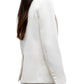 A person in the TWP Perfect Boyfriend Blazer, a white single-breasted style with long sleeves and buttoned cuffs, shown from the side against a white background.