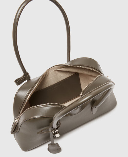The Stella McCartney Ryder Shoulder Bag is a taupe, cruelty-free handbag with top handles, shown open to reveal a spacious beige interior and an interior zippered pocket.