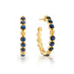 Berry Gem Medium Hoop Earrings by Juliska Capucine De Wulf—classic hoops adorned with evenly spaced round blue gemstones, displayed from front and angled side views on a white background; a timeless feminine jewelry piece.