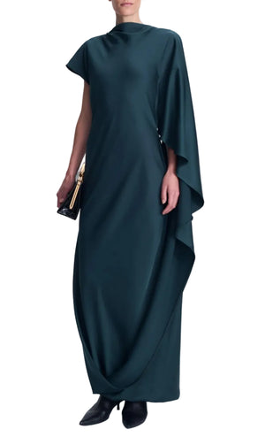 A person wears a dark teal, floor-length, draped satin Ora Satin Gown by Simkhai, featuring an asymmetrical long sleeve and a black clutch.