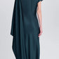 Back view of the Simkhai Ora Satin Gown, a floor-length dark green dress with an asymmetrical long sleeve and a draped panel over one shoulder.