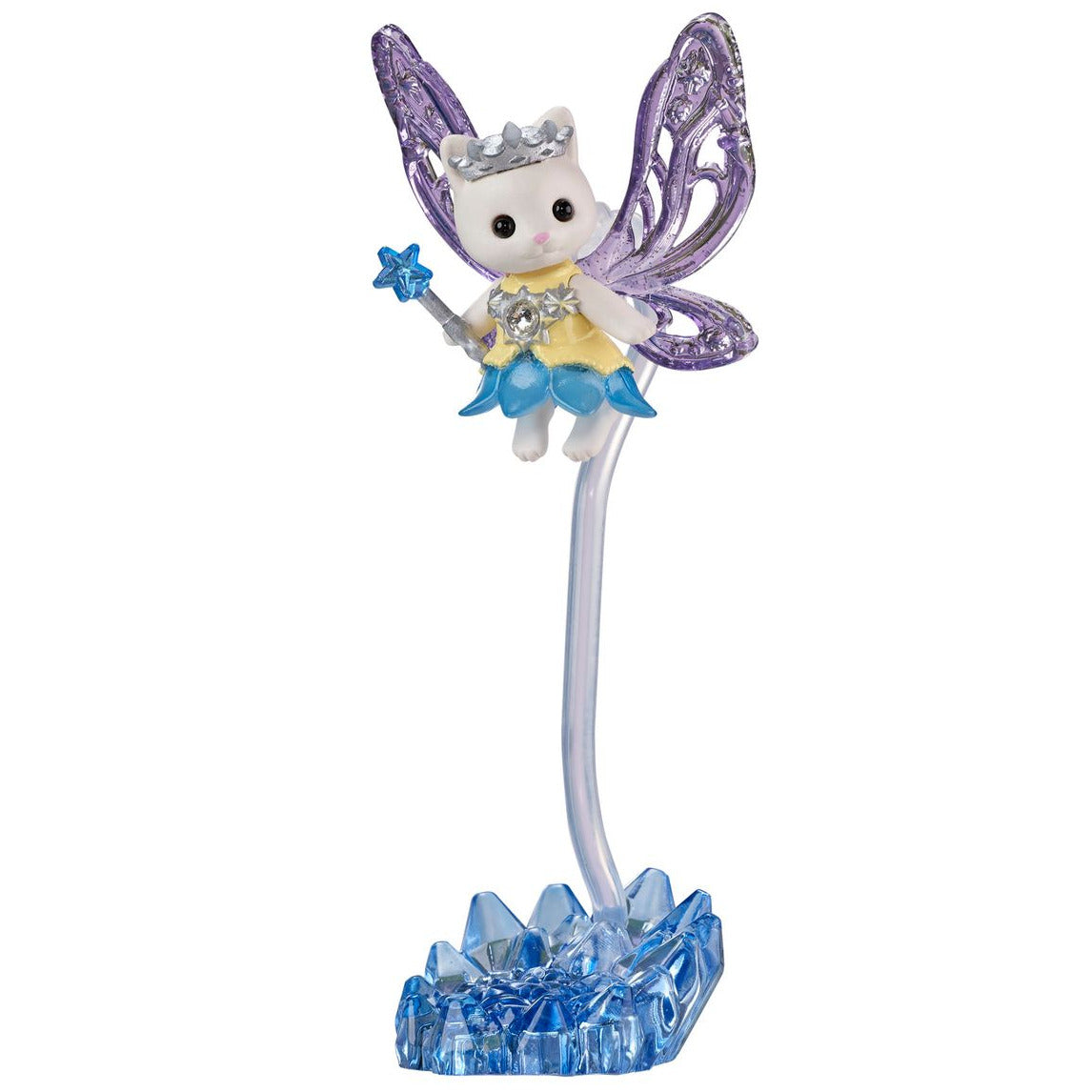 A charming white cat figurine from the Calico Critters Woodland Wonder Fairy Castle collection, featuring delicate purple wings, a crown, and a wand, stands on a sparkling blue crystal-like base supported by a curved clear stand—perfect for bringing enchantment to your magic castle display or fairy accessory collection.