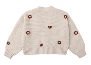 The Rylee & Cru Baby Girls' and Girls' Boxy Crop Cardigan is a beige knit with bubbled sleeves, textured pattern, and red and white flower motifs on the back and sleeves—a cozy addition to any wardrobe.