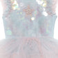 Close-up of the Baby Girls’ Bebe Mermaid Magic Tutu Dress by Tutu du Monde, featuring a light blue and pink color palette, iridescent sequins, and a star-shaped pearl embellishment on the bodice that evokes a whimsical starfish motif.