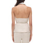 A woman is shown from the back wearing the Simkhai Campbell Halter Shirt and matching pants in a light color against a white background.