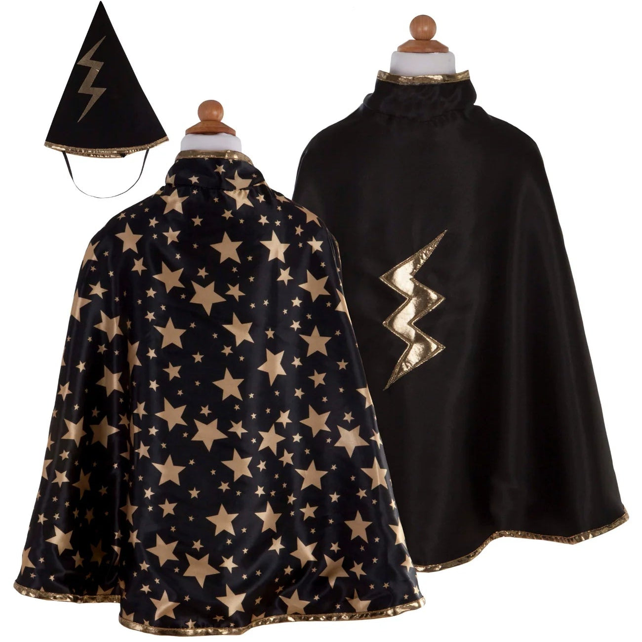 The Great Pretenders Reversible Wizard Cape & Hat set for children includes a black wizard cape decorated with gold stars, a reversible cape featuring a gold lightning bolt, and a black pointed wizard hat accented with a gold lightning bolt.